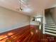 Inviting living room with hardwood floors and modern lighting fixtures throughout the open concept space at 1745 Matheson Ave, Charlotte, NC 28205