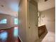 Open main bedroom flows to an ensuite bathroom, complete with a modern vanity and plenty of light at 1745 Matheson Ave, Charlotte, NC 28205