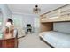 Inviting bedroom with bunk beds, desk, chair, and a cozy armchair at 200 Port Royal Dr, Matthews, NC 28105