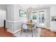 Bright dining area with hardwood floors, stylish lighting, and access to outdoor deck at 200 Port Royal Dr, Matthews, NC 28105