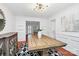 Bright dining room with hardwood floors, modern light fixture, and elegant furnishings at 200 Port Royal Dr, Matthews, NC 28105