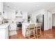 Bright kitchen with white cabinets, stainless steel appliances, and a center island with seating at 200 Port Royal Dr, Matthews, NC 28105