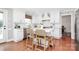 Modern kitchen featuring white cabinets, stainless steel appliances, and a center island with seating at 200 Port Royal Dr, Matthews, NC 28105
