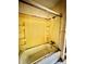 This is a closeup of the bathtub and shower stall with an adjustable shower head at 204 Long Creek Rd, Bessemer City, NC 28016