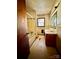 A bathroom with a tub and shower and single window above a vanity sink at 204 Long Creek Rd, Bessemer City, NC 28016