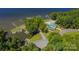 Community aerial view featuring mature trees, a pool, a clubhouse, and access to a marina at 210 Carolina Dr # 1000&999, Troy, NC 27371