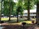 Community pool area with lounge chairs and umbrellas at 210 Carolina Dr # 1000&999, Troy, NC 27371
