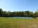 Community tennis courts surrounded by lush green trees at 210 Carolina Dr # 1000&999, Troy, NC 27371
