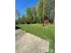 A well-maintained backyard with lush green grass and a shed at 215 Suncrest Rd, Cherryville, NC 28021