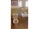 Traditional bathroom with classic tile, toilet, and sink at 215 Suncrest Rd, Cherryville, NC 28021