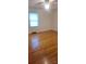 Bedroom featuring hardwood floors, window with natural light, and ceiling fan at 215 Suncrest Rd, Cherryville, NC 28021
