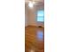 Bright bedroom with hardwood floors, a ceiling fan, and a window with blinds at 215 Suncrest Rd, Cherryville, NC 28021