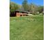 Brick home with large grassy front yard providing a peaceful view and plenty of space for outdoor activities at 215 Suncrest Rd, Cherryville, NC 28021