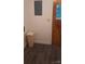 Hallway featuring neutral walls, modern vinyl flooring, and a side door at 215 Suncrest Rd, Cherryville, NC 28021
