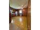 Vintage eat-in kitchen with wood paneled walls, ample cabinet space, and a ceiling fan at 215 Suncrest Rd, Cherryville, NC 28021