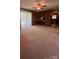 Carpeted living room offering access to outdoor space, creating a seamless transition between indoor and outdoor living at 215 Suncrest Rd, Cherryville, NC 28021