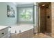 Charming bathroom featuring a soaking tub and separate shower with glass door at 2166 Potpourri Pt, Rock Hill, SC 29732