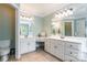 Bright bathroom featuring double sinks with vanity, mirrors, and a tiled floor at 2166 Potpourri Pt, Rock Hill, SC 29732