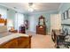 Bedroom featuring a ceiling fan, desk, dresser, carpet, and neutral green paint to enhance room at 2166 Potpourri Pt, Rock Hill, SC 29732