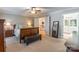 Relaxing bedroom showcases a charming wooden bed frame with a comfy upholstered storage bench at 2166 Potpourri Pt, Rock Hill, SC 29732