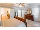 Spacious bedroom featuring a ceiling fan and large wooden dresser with decorative mirror at 2166 Potpourri Pt, Rock Hill, SC 29732