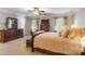 Comfortable bedroom with a king-size bed, dresser, and serene decor at 2166 Potpourri Pt, Rock Hill, SC 29732