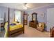 Comfortable bedroom featuring a four-poster bed, and classic wooden furnishings at 2166 Potpourri Pt, Rock Hill, SC 29732