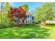 Charming two-story home with a beautiful lawn and mature trees at 2166 Potpourri Pt, Rock Hill, SC 29732