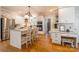 Bright and modern kitchen featuring white cabinets, granite countertops, and stainless steel appliances at 2166 Potpourri Pt, Rock Hill, SC 29732