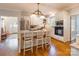 Modern kitchen boasts stainless steel appliances, white cabinetry, and a convenient breakfast bar at 2166 Potpourri Pt, Rock Hill, SC 29732