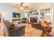Bright living room with a fireplace, built-in shelving, a ceiling fan, and comfortable seating at 2166 Potpourri Pt, Rock Hill, SC 29732