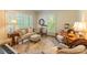 Bright living room with large windows, plush seating, and area rug at 2166 Potpourri Pt, Rock Hill, SC 29732