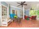 Outdoor patio with bright blue walls, terra cotta tile flooring, and ample space for entertaining at 2166 Potpourri Pt, Rock Hill, SC 29732