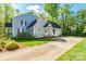 Home's side exterior featuring a spacious driveway and well-maintained lawn at 2166 Potpourri Pt, Rock Hill, SC 29732