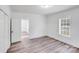 Cozy bedroom features neutral walls, natural light, and wood-look flooring at 221 River Loop Rd, Belmont, NC 28012