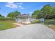 Beautiful exterior featuring a home with a front porch, a driveway, and lush greenery at 221 River Loop Rd, Belmont, NC 28012