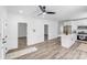 Open-concept kitchen with stainless steel appliances and a large island with eat-in counter at 221 River Loop Rd, Belmont, NC 28012