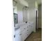 Bathroom with double sink vanity, white cabinets, and a walk-in shower at 2231 Catawba Trace Dr, Catawba, NC 28609