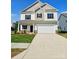 Charming two-story home with a well-manicured lawn and a two-car garage at 2231 Catawba Trace Dr, Catawba, NC 28609
