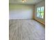 Spacious living room with light wood floors and a large window at 2231 Catawba Trace Dr, Catawba, NC 28609