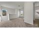 Cozy upstairs loft area with neutral carpet, natural lighting, and open space at 2231 Catawba Trace Dr, Catawba, NC 28609