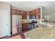 Well-equipped kitchen with stainless steel appliances, granite countertops, and hardwood floors at 2268 Kensington Station Pkwy, Charlotte, NC 28210