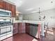 Kitchen featuring stainless steel appliances, hardwood floors, and granite countertops with open concept at 2268 Kensington Station Pkwy, Charlotte, NC 28210