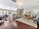 Spacious living room featuring hardwood floors, a stylish chandelier, and comfortable seating at 2268 Kensington Station Pkwy, Charlotte, NC 28210