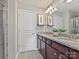 Main bathroom boasts a double vanity, granite countertops, and a large mirror with great lighting at 2268 Kensington Station Pkwy, Charlotte, NC 28210