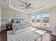 Comfortable main bedroom featuring a trey ceiling, ceiling fan, carpet, and lots of natural light at 2268 Kensington Station Pkwy, Charlotte, NC 28210