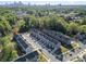 Overhead shot of gray townhouses in a lush, green community near the city with easy access to highways at 2410 Dr Carver Rd, Charlotte, NC 28208