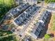 A beautiful aerial view of new construction townhomes within a well-kept community at 2410 Dr Carver Rd, Charlotte, NC 28208