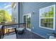 Cozy deck, perfect for outdoor relaxation with table and chairs overlooking the backyard at 2410 Dr Carver Rd, Charlotte, NC 28208