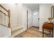 Welcoming foyer features hardwood floors, staircase, and coat closet for easy access to storage at 2410 Dr Carver Rd, Charlotte, NC 28208